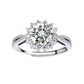 Close-up of sterling silver halo ring with brilliant round moissanite center stone surrounded by smaller accent stones