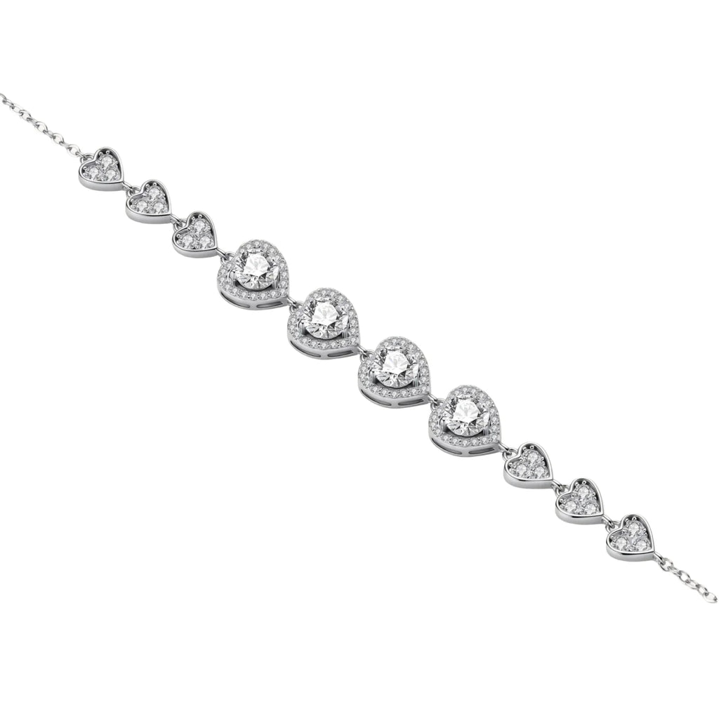 Complete jewelry set with heart-shaped sterling silver pieces featuring brilliant moissanite stones on white background.