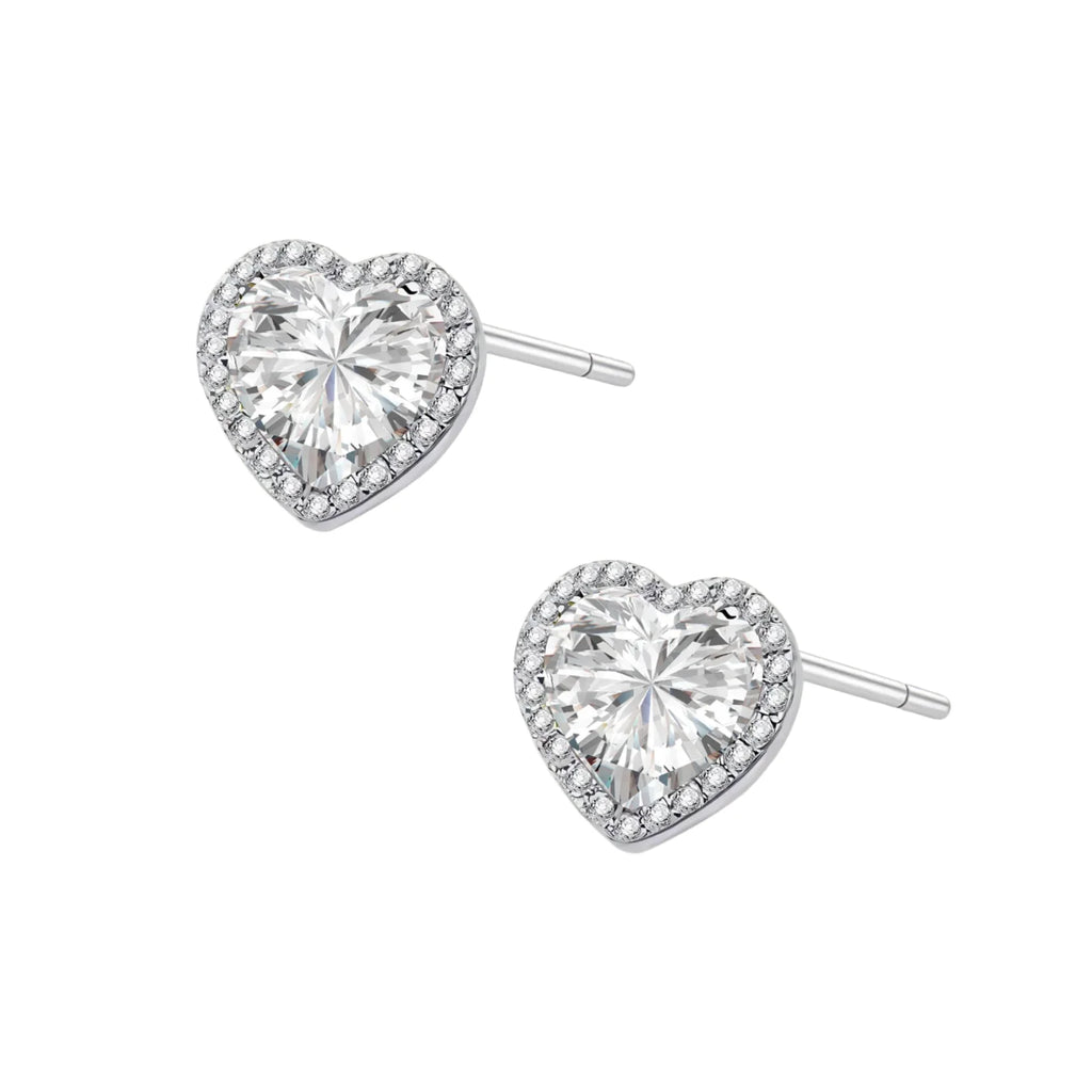 Complete jewelry set with heart-shaped sterling silver pieces featuring brilliant moissanite stones on white background.