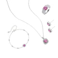 Sterling silver jewelry set featuring pink moissanite stones in halo settings on white background.