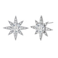 Sterling silver star-shaped stud earrings with brilliant moissanite center stones and pavé details on neutral background.