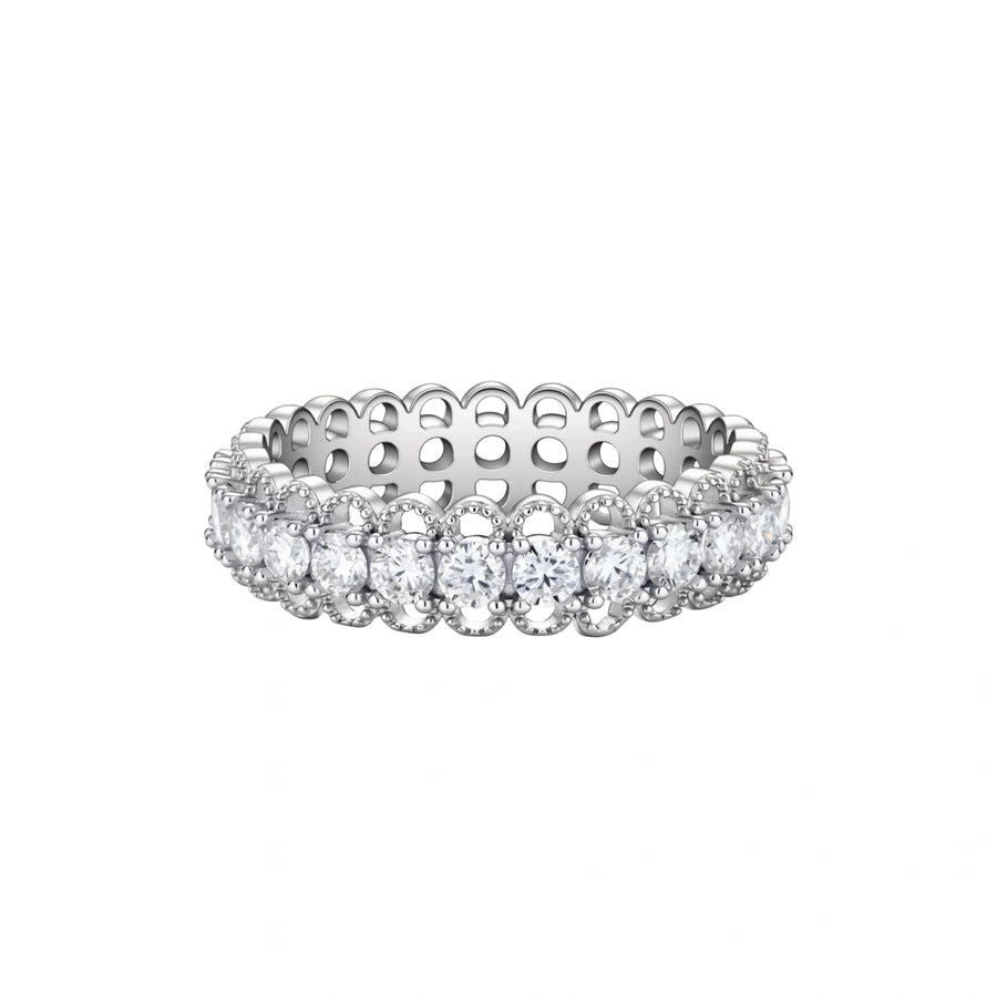 Sterling silver eternity ring with continuous row of brilliant moissanite stones in scalloped crown setting with milgrain detail