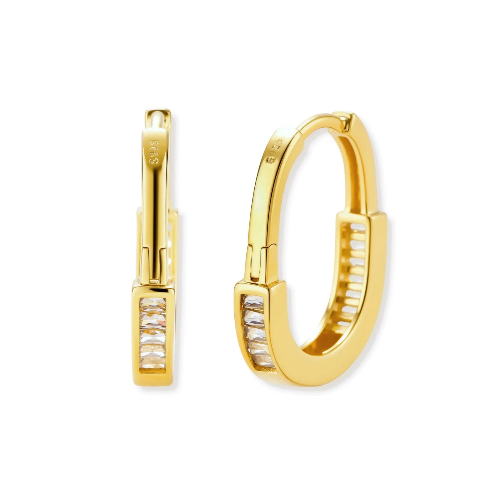 Close-up of gold-plated sterling silver huggie hoop earrings featuring rectangular cubic zirconia stones on neutral background.