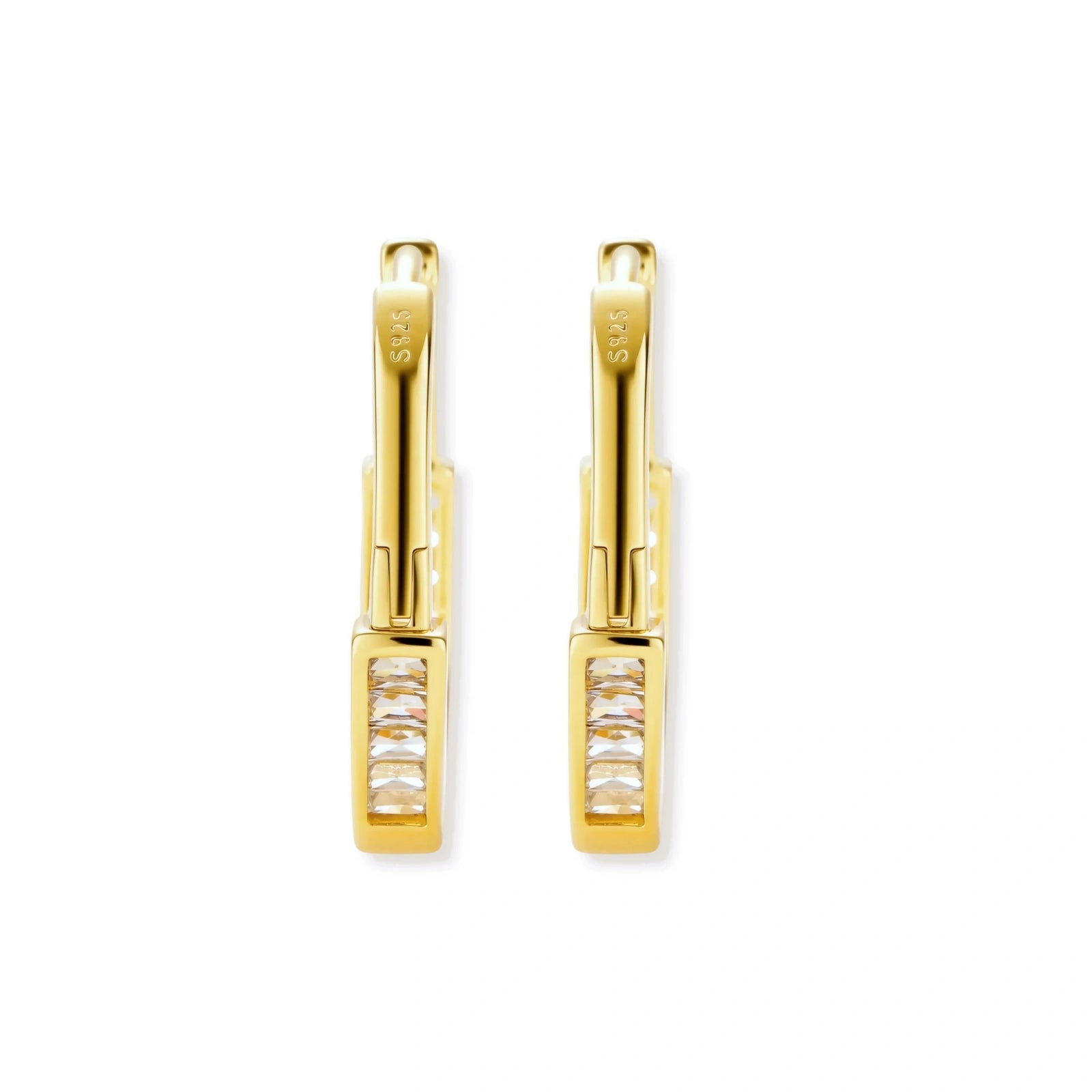Close-up of gold-plated sterling silver huggie hoop earrings featuring rectangular cubic zirconia stones on neutral background.