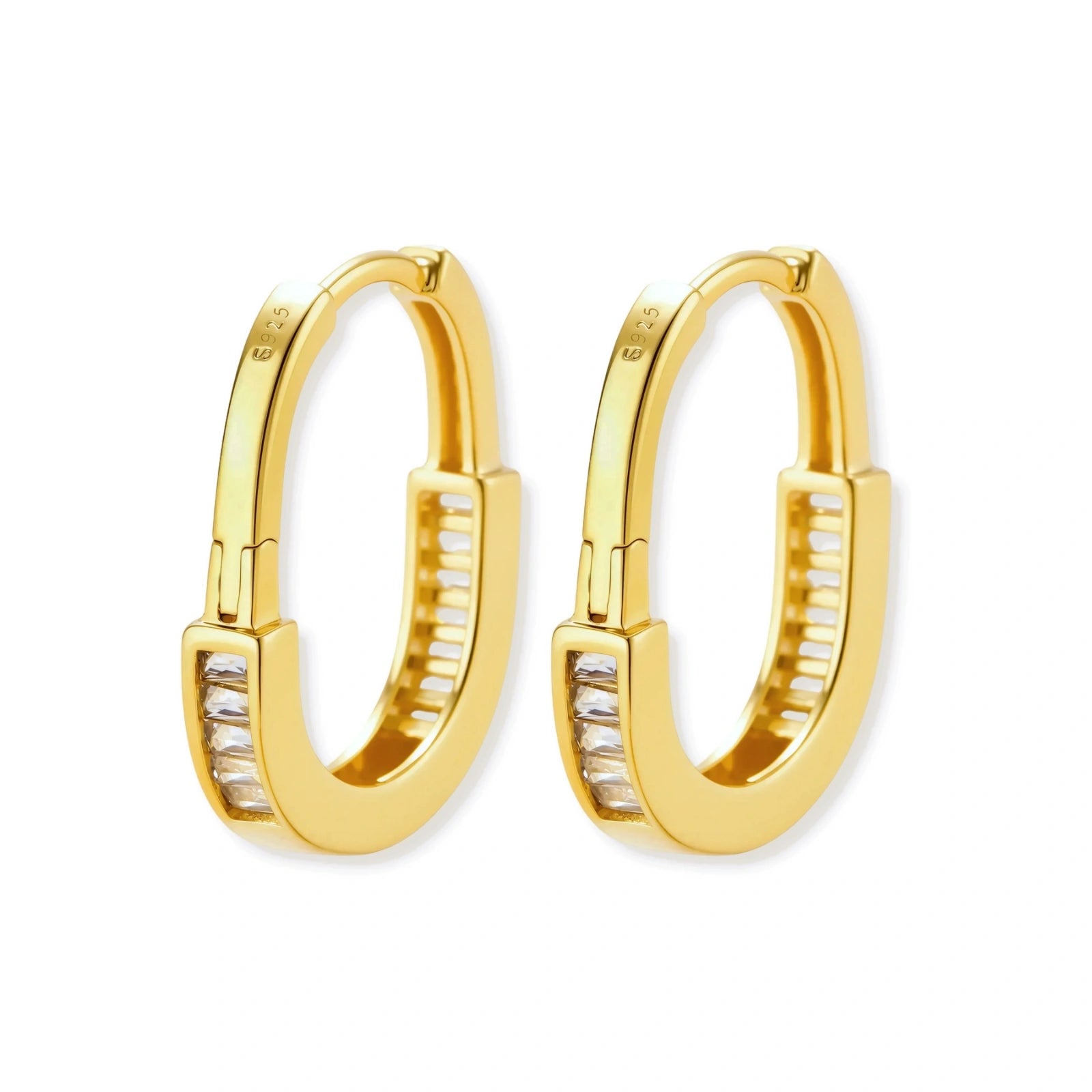Close-up of gold-plated sterling silver huggie hoop earrings featuring rectangular cubic zirconia stones on neutral background.