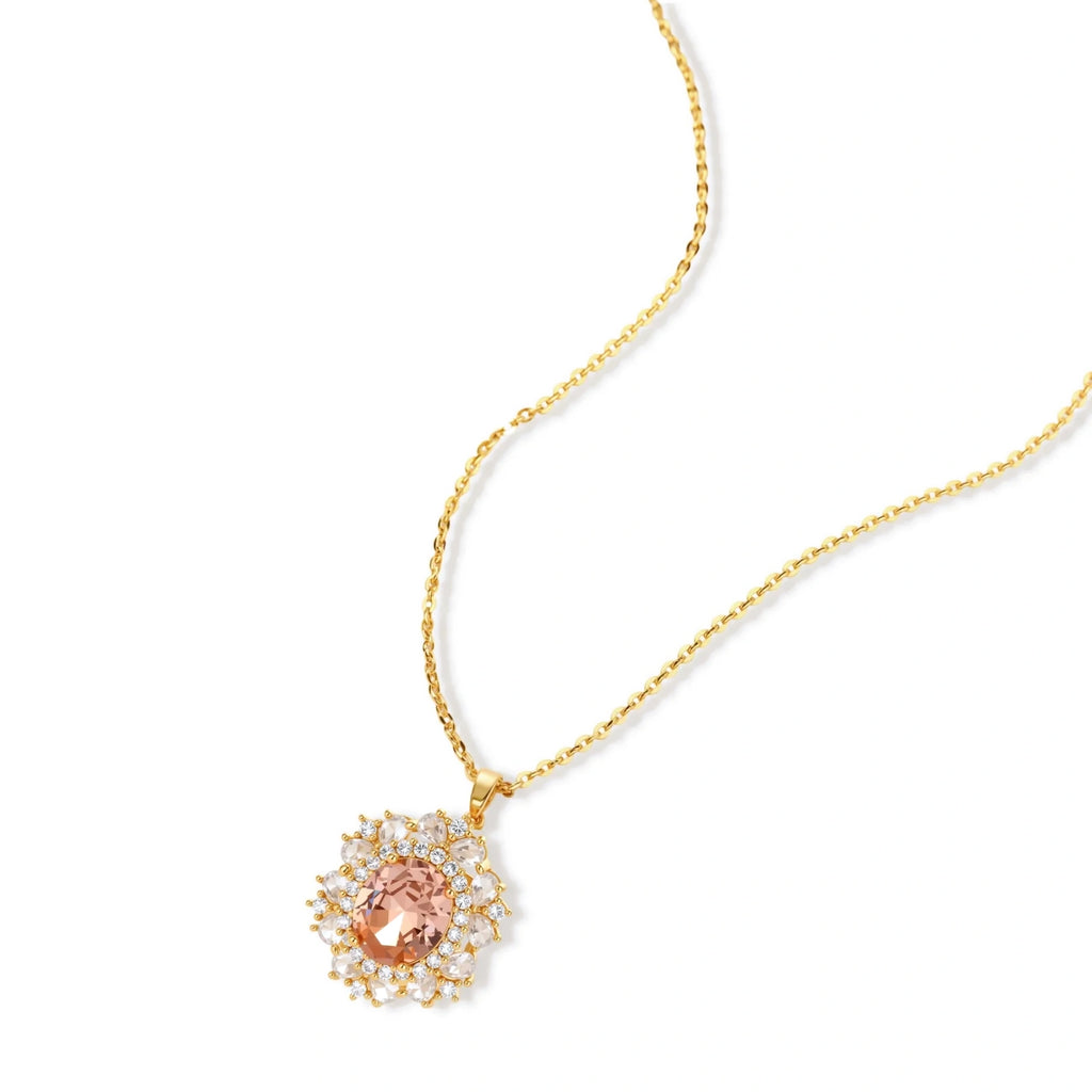 Ornate gold-plated jewelry set featuring peach center stone surrounded by clear AAA cubic zirconia crystals